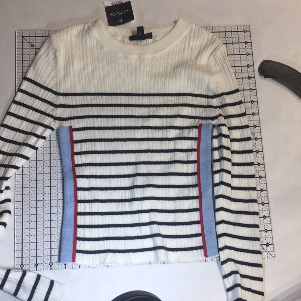 Top shop striped cream and black with blue & red racing stripes down arm & side.